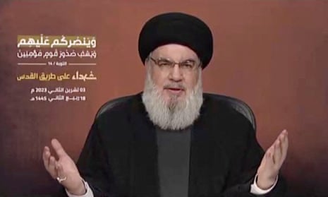 Hassan Nasrallah, wearing a black turban and clothes, delivers a television address straight to camera