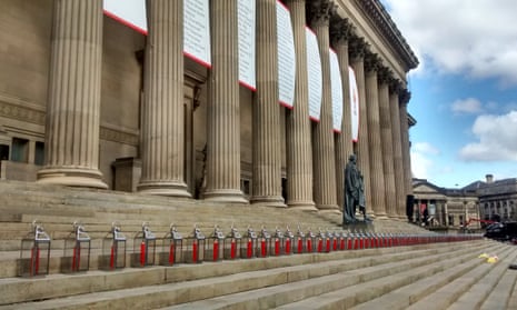 Candles and banners outside St George's Hall in Liverpool.