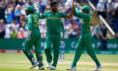Pakistan’s Rumman Raees is congratulated by his team-mates after taking the wicket of England’s Liam Plunkett.