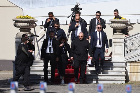 Ukrainian defence minister Rustem Umerov (C) leaves after attending the second round of peace talks in Istanbul.