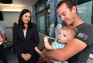 Annastacia Palaszczuk talks to Grant Morgan and his son Kyle in the children’s ward at the Townsville hospital on Monday.