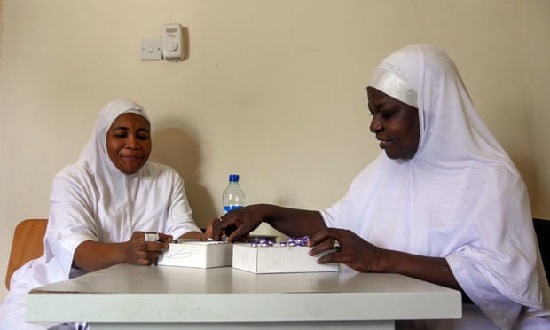 Nurse-midwife Zainab Malut (right) sorts out supplies with a colleague at their family planning clinic in Maiduguri.