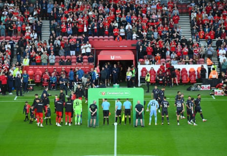 The Middlesbrough and Wrexham players line up ahead of kick-off.