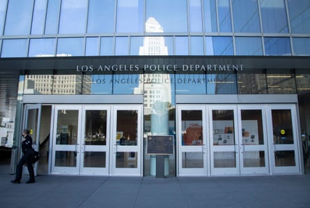 An officer exits the Los Angeles police department building.