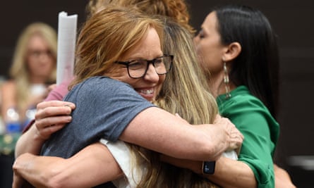 Representative Sharice Davids (D-KS) hugs other supporters of abortion rights at the election watch party in Overland Park, Kansas August 2, 2022.