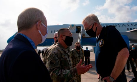 The acting US defense secretary, Christopher Miller, greets Maj Gen Lapthe Flora, the commanding general of combined joint taskforce – horn of Africa, which is involved in Somalia operations, last month.