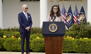 Joe Biden looks on as school shooting survivor Mia Tretta speaks in the Rose Garden