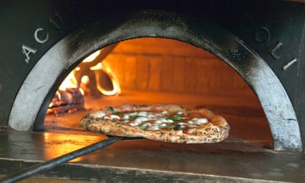 PIzza being slid into the oven at Paesano West End, Glasgow