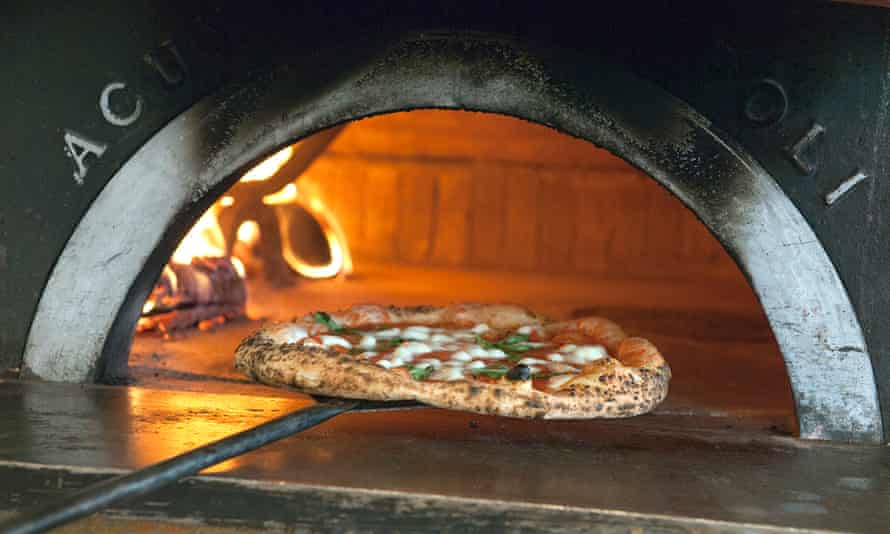 PIzza being slid into the oven at Paesano West End, Glasgow