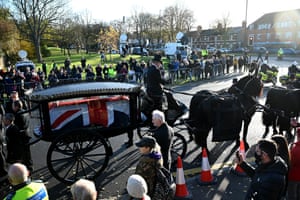 A horse-drawn hearse carries the coffin from St Mary’s parish church after Sir David Amess’s funeral