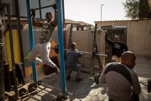 Johannesburg, South Africa: Sandi Makama, 40, does pull-ups in the early morning hours at the iKasi gym, a community project yards from former president Nelson Mandela’s house