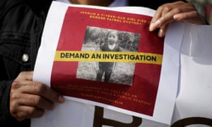A woman holds a photo of Jakelin Caal during a protest on December 15 in El Paso, Texas.