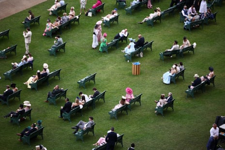 Racegoers relax ahead of racing on the fifth day of Royal Ascot.