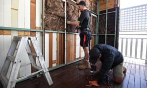 Builders working on a house