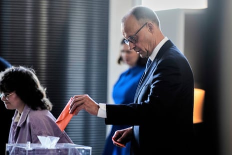 Friedrich Merz casts his vote during the election of a new Chancellor at the parliament Bundestag in Berlin.