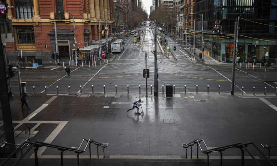 A person rides a scooter past a quiet Southern Cross Station in locked down Melbourne, Friday, 16 July 2021.