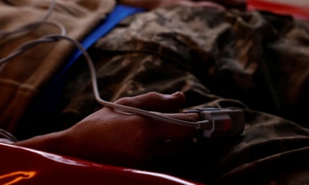 A wounded Ukrainian soldier is evacuated in a converted bus from the eastern frontline near Bakhmut on 15 March 2023.