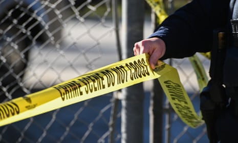 Police tape at a crime scene after a shooting at the Spanish Town shops in Half Moon Bay, California, on 24 January 2023.