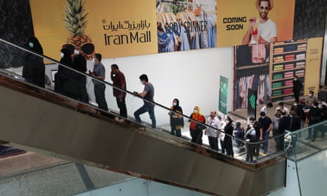 People at a shopping centre where a Covid-19 vaccination centre is located in Tehran