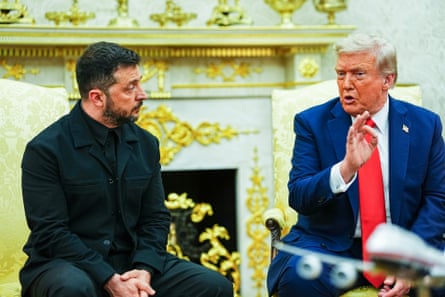 two men sit in a room with golden decor