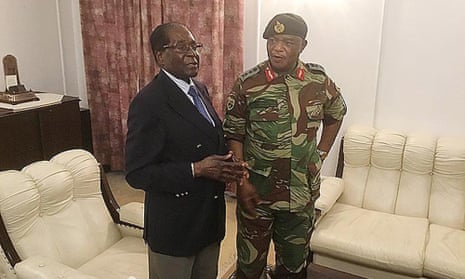 Robert Mugabe talks to General Constantino Chiwenga at State House in Harare