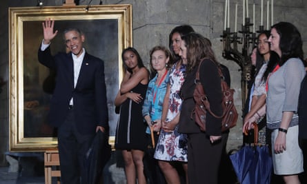 Barack Obama along with Michelle, Malia and Sasha stop to look at a painting of Abraham Lincoln in the Museum of the City of Havana.
