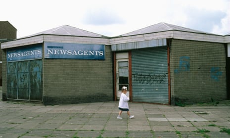 A young girl walking through a housing estate in Skelmersdale, Lancashire