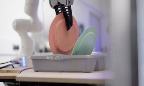 a Dyson robot prototype does the washing up