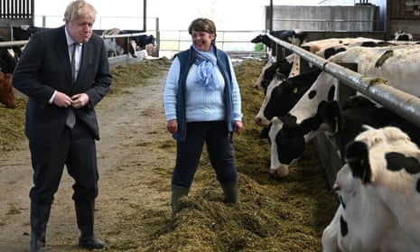 Boris Johnson with Welsh Conservative candidate Barbara Hughes during a visit to Moreton farm in Clwyd near Wrexham, north Wales, earlier today.