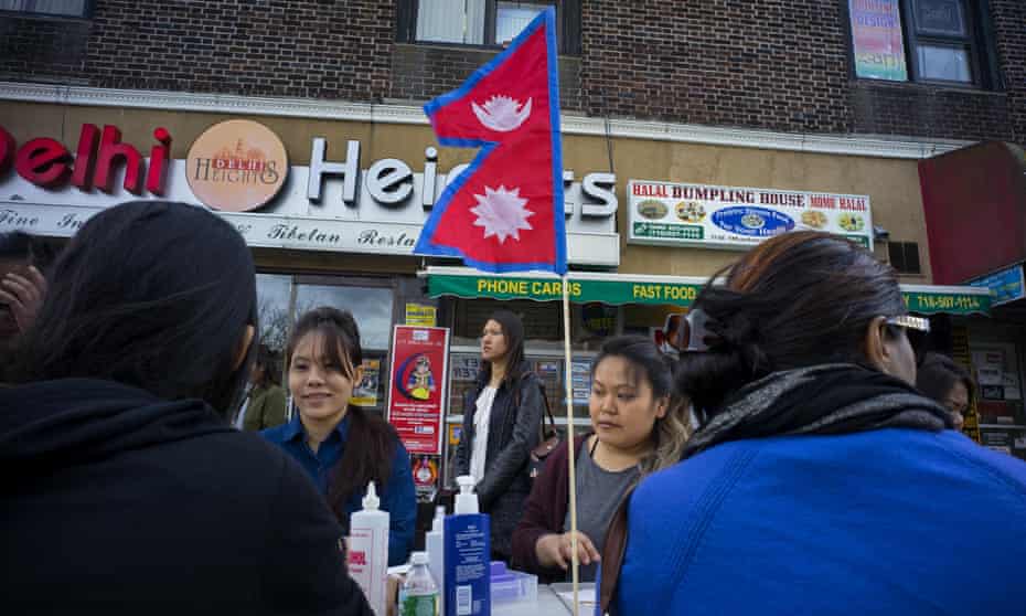 People receive manicures for Nepal donations in the Jackson Heights section of the Queens borough of New York.