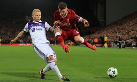 Maribor’s Martin Milec gets the better of Liverpool’s Alberto Moreno and wins the ball.
