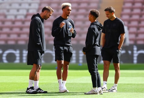 Fulham’s players get their chat on ahead of kick-off against Liverpool at Anfield