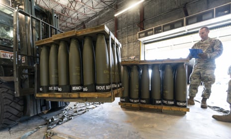 A US air force staff sergeant checks pallets of 155mm shells ultimately bound for Ukraine in April. 