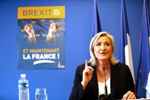 France’s Front National leader Marine Le Pen gestures as she speaks to journalists at the FN headquarters in Nanterre, calling for referendums on EU membership in France