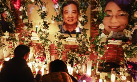 Victims’ pictures are displayed at a candlelight vigil at the memorial outside the Star Ballroom Dance Studio where a deadly mass shooting took place on 25 January in Monterey Park, California.