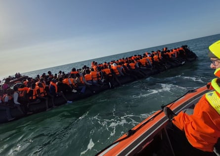 Overloaded vessel carrying dozens of people in lifejackets