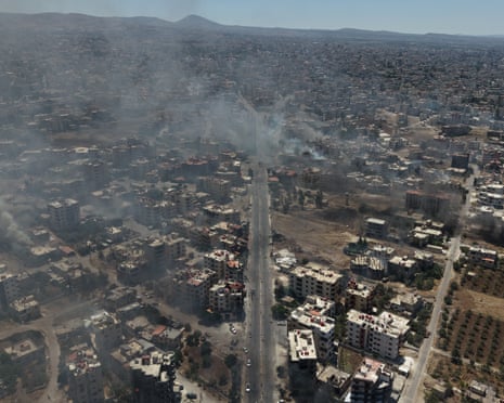 An aerial view of Sweida, as smoke rises as clashes between the alliance of Bedouin Arabs and tribal forces and some Druze groups continue on the western and northern lines of the city in Syria on 19 July 2025.
