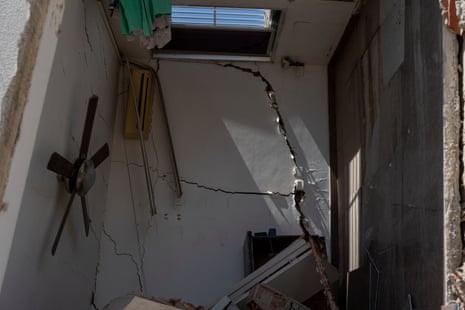The position of a ceiling fan shows how an apartment building was tipped on its side in La Guaira.
