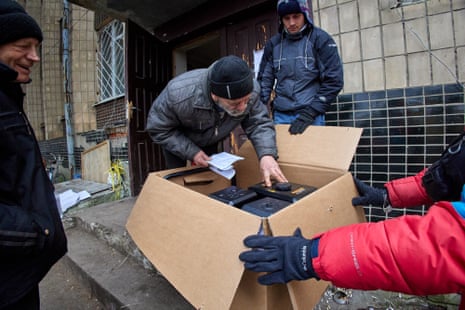 Volunteers and the Ukrainian military distribute humanitarian aid to locals in the recently recaptured territory of Kupiansk in northeastern Ukraine.