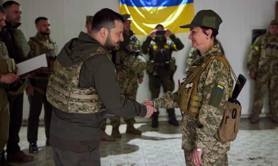 Ukraine’s president, Volodymyr Zelenskiy, gives an award to a Ukrainian soldier as Russia’s attack on Ukraine in the east continues.