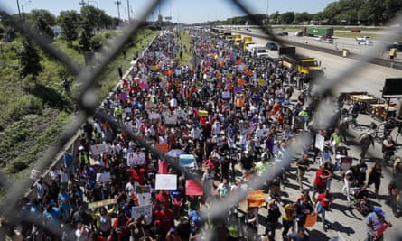 Thousands of activists march onto Chicago’s Dan Ryan Expressway on Saturday