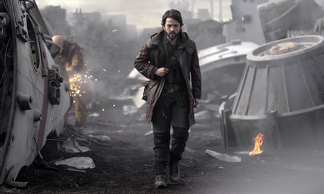 Diego Luna as Cassian Andor walks through a scrapyard of spaceship parts in Andor.
