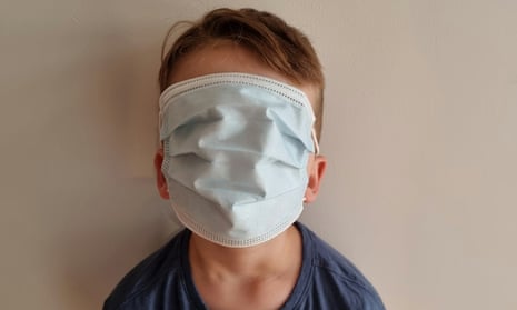 Child with face mask covering entire face