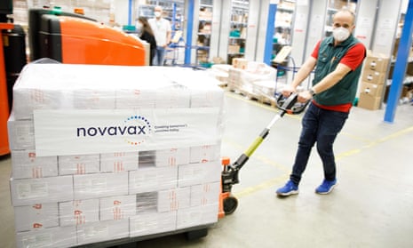 A man pulls a pallet with the “Nuvaxovid” Covid vaccine by US company Novavax after a shipment of the vaccine arrived at a warehouse in Hagenbrunn, Lower Austria. The two-dose vaccine is based on synthetic proteins that mimic the spikes that dot the surface of the virus.