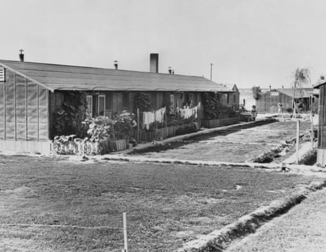 Laundry dries in front of each apartment. Detainees had planted quick-growing vegetation and grass to beautify the camp and settle the ever-present dust in Minidoka, Idaho, 1 November 1942.