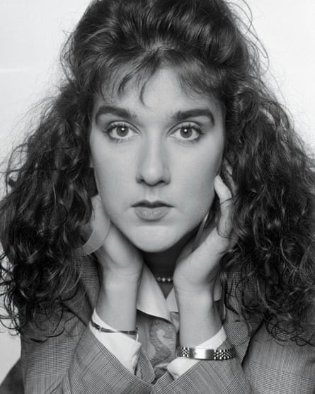 A black and white closeup portrait of a young Céline Dion with bouffant hair