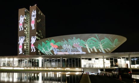 A projection on the building of the National Congress with drawings of the Yanomami xapiri, the spirits of the Forest, is seen during a protest to evict illegal goldminers from Brazil’s largest indigenous Yanomami reservation.