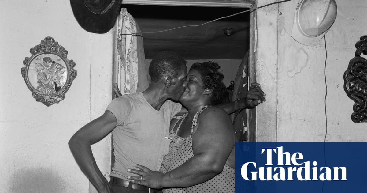 A husband and wife kiss in a doorway: Baldwin Lee's best photograph