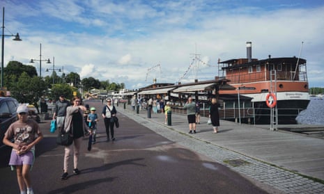 People visit the marina area of the city of Lappeenranta in Finland, where Russian tourists stream into Finland.