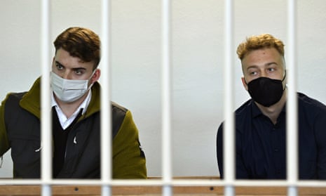 Gabriel Natale-Hjorth, left, and Finnegan Lee Elder sitting behind bars inside the courtroom.